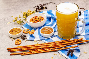 Oktoberfest set. Light beer, pretzels, mustard, sesame straw, hop.