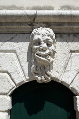 decorative mask on a door