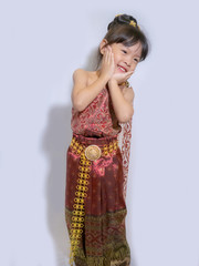 Thai little girl in traditional Thai costume in white background