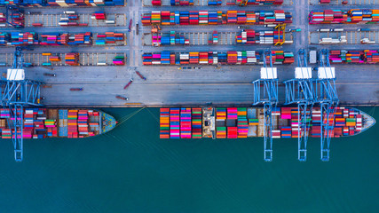 Container ship is loading in a port, Aerial top view container ship.