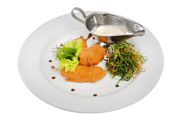 Fried chicken nuggets with seaweed with white sauce on a white isolated background