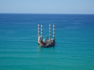 Aerial view of a temporary ocean drilling rig
