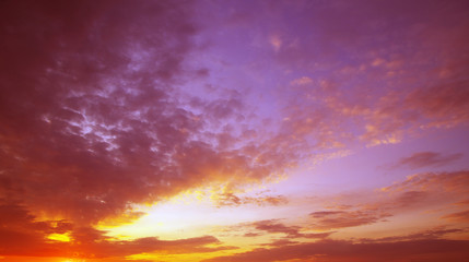 Naklejka na ściany i meble Sunset with sun rays, sky with clouds and sun