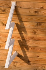 Merry Christmas and Happy New Year. Greeting card, brochure for Christmas time. Schematic wooden tree on wooden background. Sample for design. Interior design background