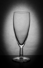 silhouette of an empty glass on a white background with a vignette