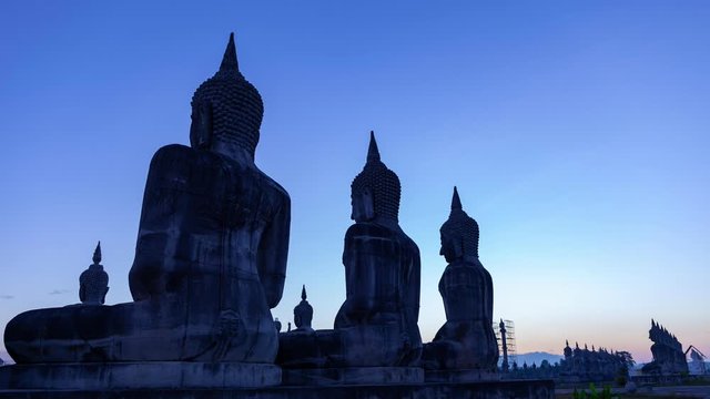 Row of big buddha in the beautiful sunrise 4K Timelapse footage