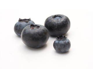 Fresh organic blueberries closeup on white