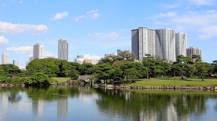 Obraz na płótnie Canvas TOKYO, JAPAN. 2019 Sep 26th. View of Hamarikyu Japanese Garden and High-Rise Buildings.