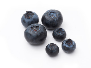 Fresh organic blueberries closeup on white