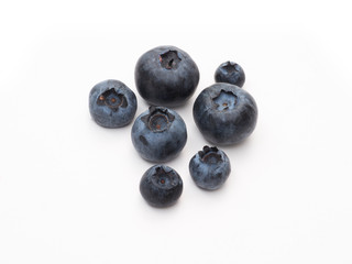 Fresh organic blueberries closeup on white