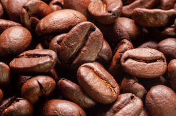 Coffee beans macro shot. Full frame roasted coffee beans background.