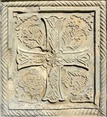 Christian pattern carved in stone on the wall of an old Christian church in Georgia