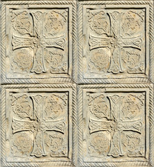 Christian pattern carved in stone on the wall of an old Christian church in Georgia