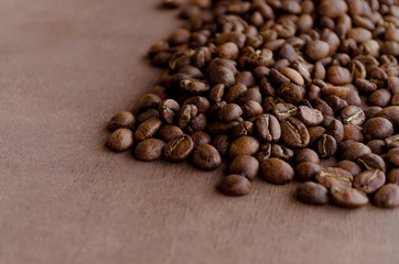 Specialty coffee beans brown wood background