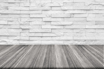 white brick wall and wooden floor