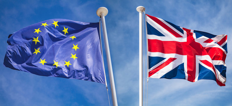 Brexit concept with flags over blue sky