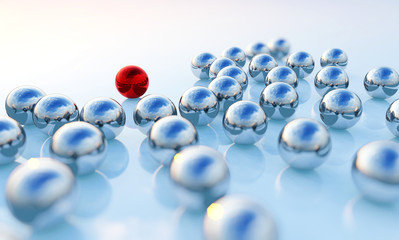 Concept or conceptual collection of balls with a red one standing out on blue background as a metaphor for creativity, leadership and independence. A courage, action and success 3d illustration