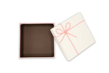 Top view of open pink-white gift box and leather ribbon bow with tag isolated on white with clipping path use for Valentine's Day, Happy Women's Day, Mother's Day, Birthday, Wedding, Christmas.