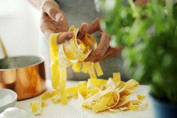 Fototapeta na wymiar Pasta chef makes fresh italian pasta