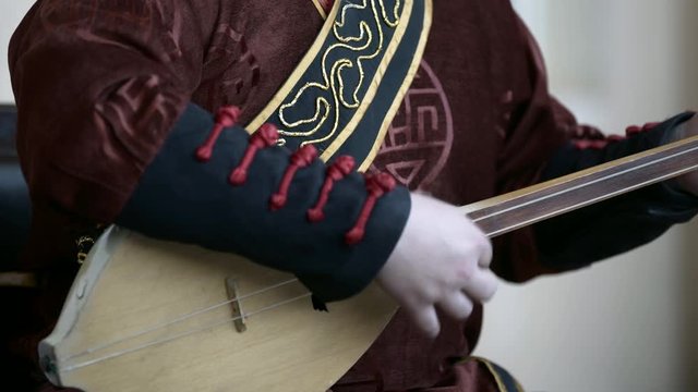 Lockdown: Musician Playing a Stringed Musical Instrument - Erlian, Mongolia