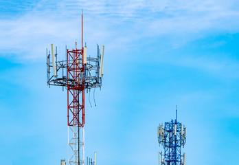 Telecommunication tower with blue sky and white clouds background. Antenna on blue sky. Radio and...