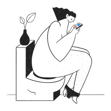 Woman sitting on toilet scrolling on phone
