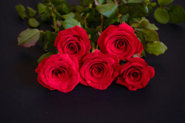 Big bouquet of red roses. Event design style. Romantic atmospheric photo of flowers