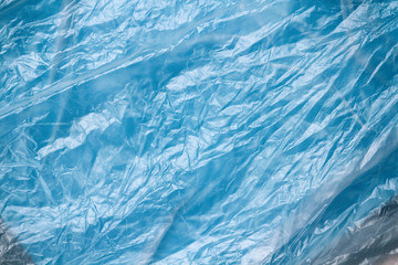 Clear plastic bag texture background. Waste recycling concept. Crumpled polyethylene and cellophane. 