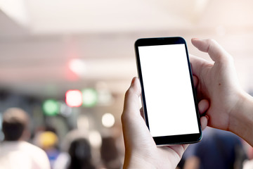 Close up Woman hand Using a Smart Phone with blank screen at maket.