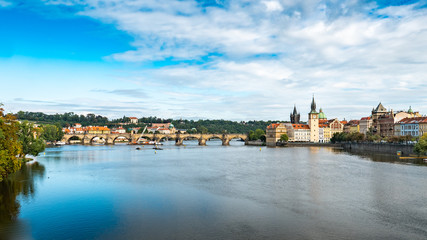 Prague and the Vlatava River. The Charles Bridge and Old Town Bridge Tower landmarks in the Czech...