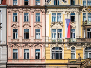 Fototapeta na wymiar Classic Bohemian town house architecture adored with the national flag of the Czech Republic in the historic Prague city centre.