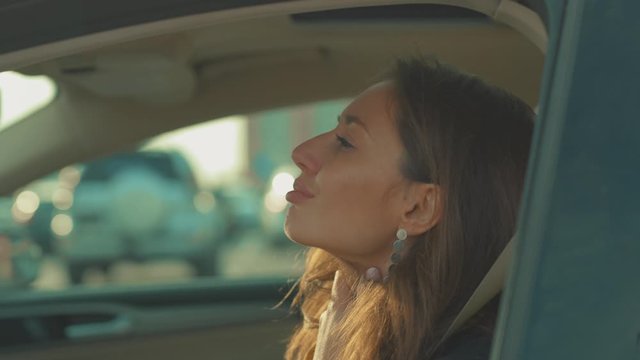 Young woman sitting in car sore throat feeling sick vehicle influenza health illness flu medical sickness problem business infection stress disease medicine virus exhausted headache slow motion