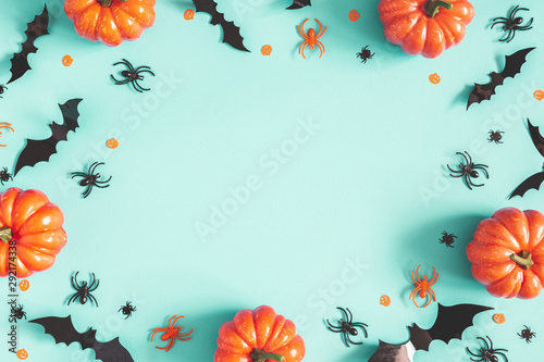 Halloween decorations on blue background. Halloween concept. Flat lay, top view, copy space