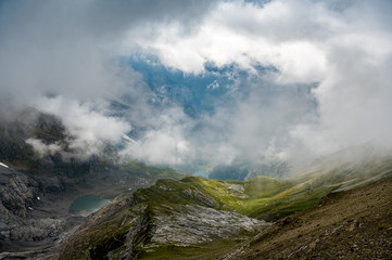 deep hanging clouds over Rossbode See on a rainy summer afternoon