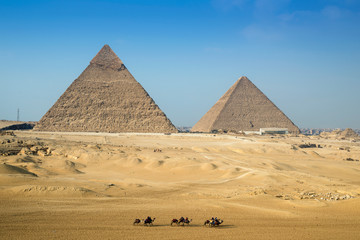 Fototapeta na wymiar Camel rides around the Giza pyramid complex, Cairo, Egypt
