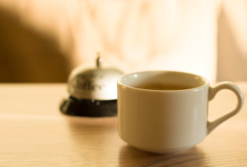 A cup of coffee. Wake up The concept of early awakening. Background with copy space for text. Steaming coffee cup on a background of sunbeams, coffee good time. Good morning coffee.