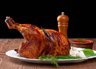 image of delicious roasted chicken on wood background