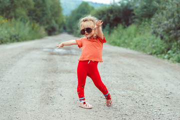 little girl dancing in glasses