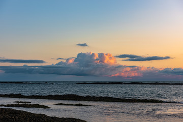 Big colorful cloud over the ocean