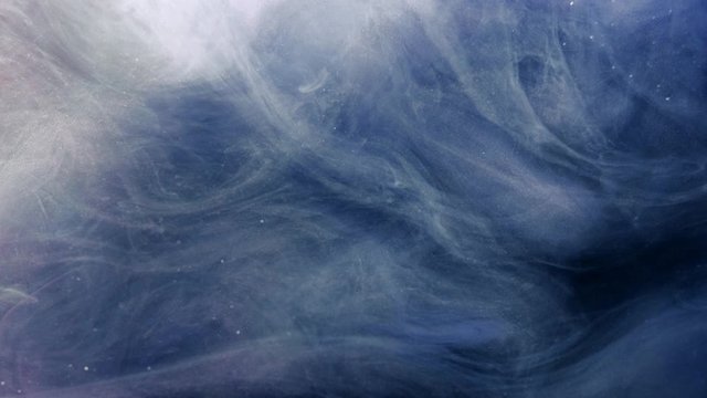 Smoke flow. Magic spell. White glitter haze cloud motion over blue background.