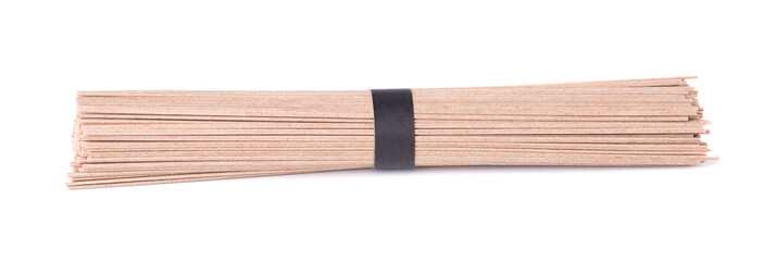 Soba noodles, isolated on white background. Bundle of buckwheat japanese soba noodle sticks. Asian food.