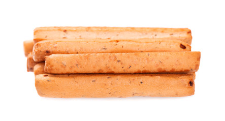 Bread sticks isolated on white background. Grissini, Italian breadsticks with onions and herbs.
