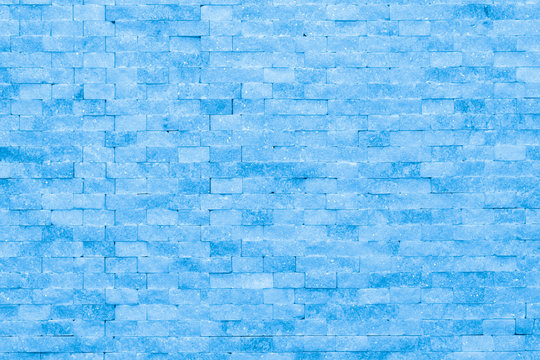 Wall of blue ice bricks and blocks background texture