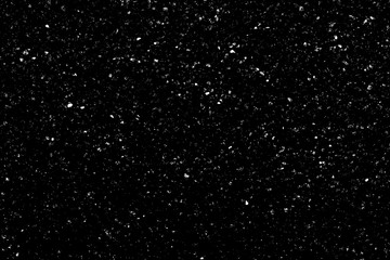 WHITE BOKEH ON A BLACK BACKGROUND. LIGHT SPOTS TEXTURE. FALLING SNOW. STAR SKY.