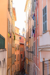 Nice, France, colorful facade, with typical windows and shutters, in a charming street 