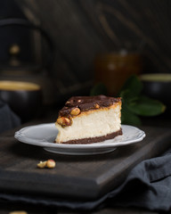 A classic creamy cheesecake with a chocolate base, roasted peanuts, salted caramel and chocolate - a favorite popular chocolate sweet