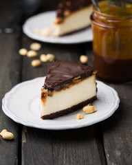 A classic creamy cheesecake with a chocolate base, roasted peanuts, salted caramel and chocolate - a favorite popular chocolate sweet