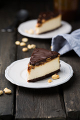 A classic creamy cheesecake with a chocolate base, roasted peanuts, salted caramel and chocolate - a favorite popular chocolate sweet