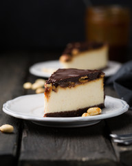 A classic creamy cheesecake with a chocolate base, roasted peanuts, salted caramel and chocolate - a favorite popular chocolate sweet