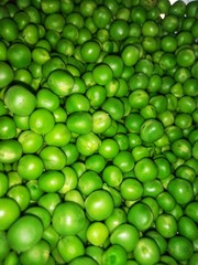Closeup picture of green seeds of peas with smartphone camera.